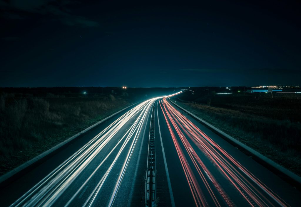 Long exposure image of a busy highway at night