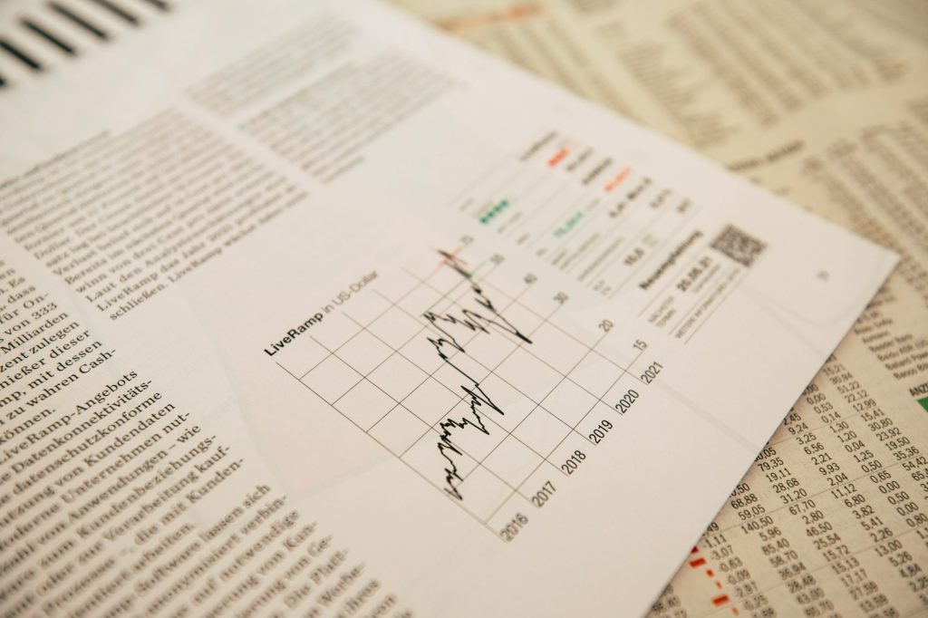 Close up of investment documents and a growth trend chart